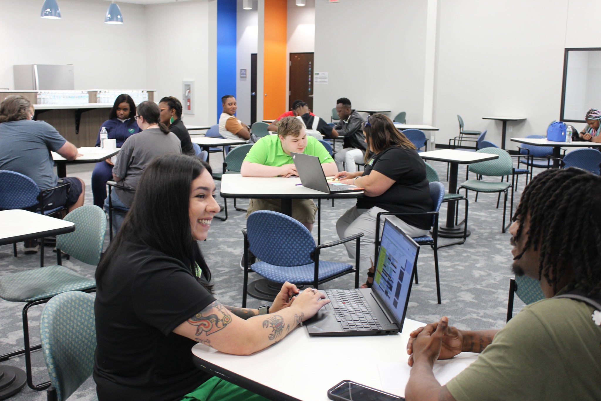 A volunteer and shopper smiling in a Goodwill store (placeholder image).